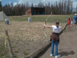 ellie shooting bow and arrow